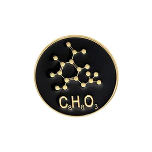 Macro detail of a black enamel science pin featuring gold molecular structure and C8H8O3