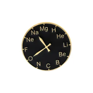 Macro shot of circular enamel brooch featuring twelve chemical element symbols and clock hands