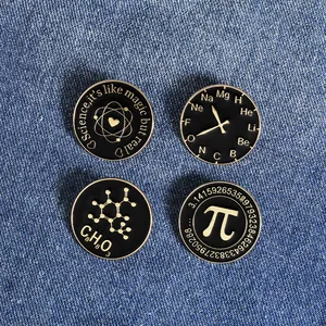 Macro shot of four scientific enamel pins featuring pi, chemistry formulas, and geek quotes
