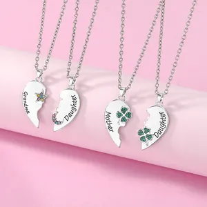 Detail of interlocking heart necklaces for Grandma Mother and Daughter with clover stones