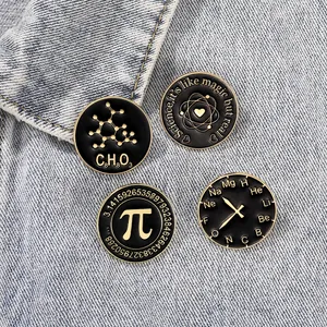 Set of 4 science enamel pins with Pi and chemistry formulas on blue denim background
