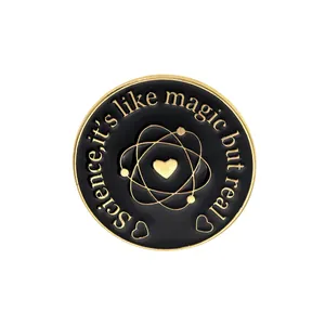 Science is magic but real enamel pin with golden atom and heart on black background