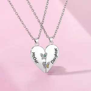 Close-up of Mother and Daughter heart pendant with colorful butterfly stones