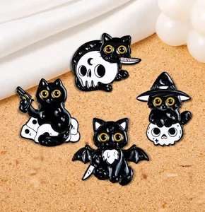 Detail view of gothic black cat enamel pins featuring a bat wing cat and wizard hat design
