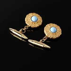 Details von Vintage Gold Manschettenknöpfen mit blauem Stein und Blumenmuster Gravur