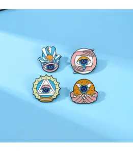 Set of four unique blue evil eye enamel pins featuring Hamsa hand and mystic motifs