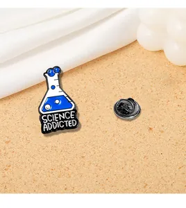 Detail of enamel science flask brooch with Science Addicted text and black pin clutch