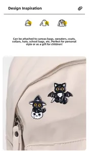 Detail of Halloween black cat enamel pins with wizard hat and bat wings on a canvas bag