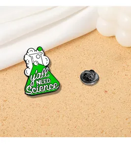 Macro shot of green chemistry flask enamel pin with y'all NEED Science text and back pin
