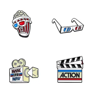 Movie theme enamel pins featuring 3D glasses popcorn and film clapperboard design