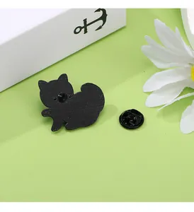 Detail view of the black cat enamel pin back with secure butterfly clutch and metal texture