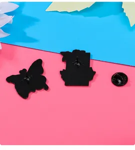 Macro view of the matte black zinc alloy pin backings with secure rubber clutch fasteners