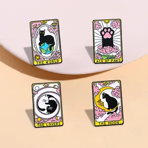 Tarot-inspired black cat enamel pin set featuring The World and The Lovers designs