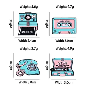 Retro enamel pins set featuring camera, cassette, phone, and record player with dimensions