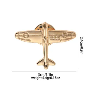 Macro detail of gold airplane brooch with 3cm x 2.4cm dimensions and weight info