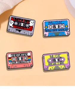 Set of four retro enamel music cassette pins featuring colorful creative spooky themes
