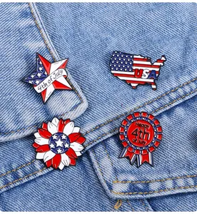 Detail of four USA flag themed enamel pins on denim for Independence Day gift