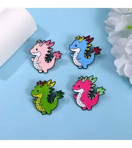 Detail view showing four colorful enamel dragon badges with intricate polished metal outlines