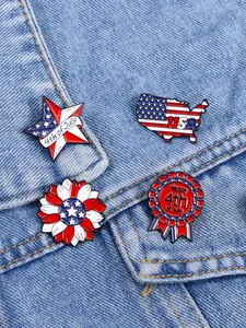 Detail of four USA Independence Day enamel pins on denim, featuring patriotic star and map