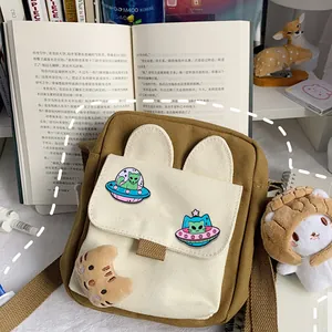 Japanese style canvas crossbody bag with cartoon cat ears and embroidery badges