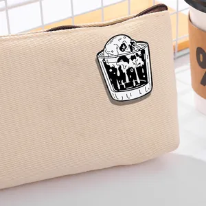 Punk gothic skull ice cream enamel pin pinned on a premium canvas bag with zipper