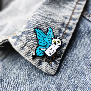 Cute white cat brooch with blue butterfly wings and Cat Happy text on denim jacket