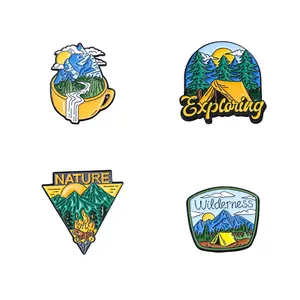Set of four colorful outdoor adventure enamel pins with mountain and camping designs