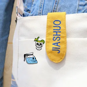 Punk style skull cocktail and coffee pot enamel pins on white canvas bag