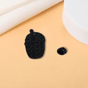 Matte black punk skeleton badge backplate set with geometric texture and butterfly clasp