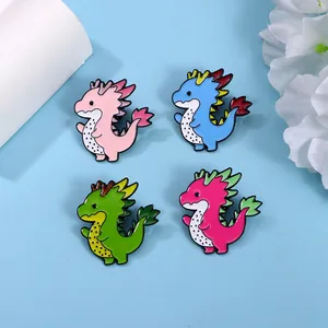 Set of four cute dragon fruit dinosaur enamel pins in pink, blue, and green colors