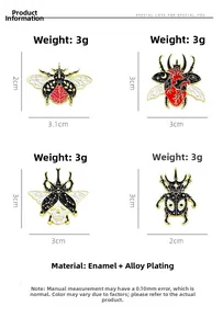 Macro view of detailed enamel insect brooches featuring skull and heart artistic motifs