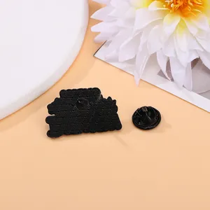 Customized black enamel pin with anti-slip back texture and matching butterfly clutch buckle