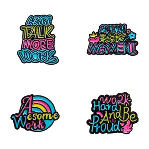 Set of 4 creative colorful enamel pins with motivational quotes on a white background