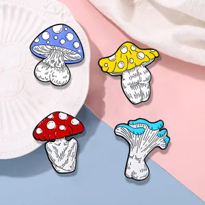 Macro detail of four creative enamel mushroom pins with unique artistic body shapes