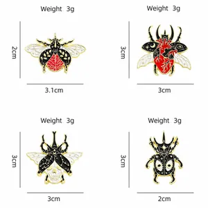 Artistic insect enamel pins featuring creative beetle and bee designs with surreal motifs