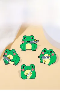 Detail of four creative cartoon frog enamel pins with daggers and golden star accents