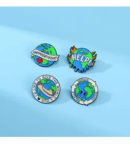 Macro detail of four enamel pins with Happy Earth Day and environmental slogans