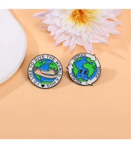 Close-up of enamel pins with Save the Earth slogans and hug the world graphic design