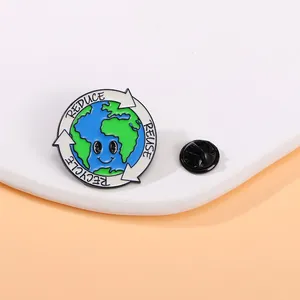 Detailed view of Earth enamel pin with recycle arrows and a black rubber clutch backing