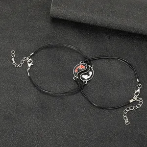 Detail of woven Yin Yang koi fish couple bracelets with adjustable lobster clasp and chain