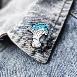 Creative mushroom character enamel pin displayed on a denim collar as a stylish accessory