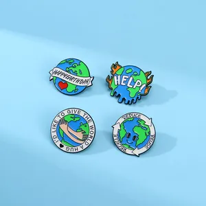 Set of four Earth Day enamel pins with eco-friendly slogans on a soft blue background