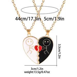 Detail view of heart-shaped puzzle pendants with stick figure art for BFF or couples