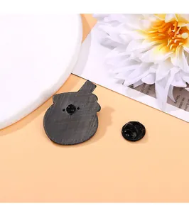 Detailed back view of a black heart cat enamel pin with rubber clutch and textured metal