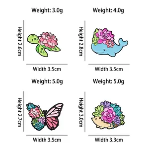 Colorful animal enamel pins set with succulents featuring turtle whale butterfly and hedgehog