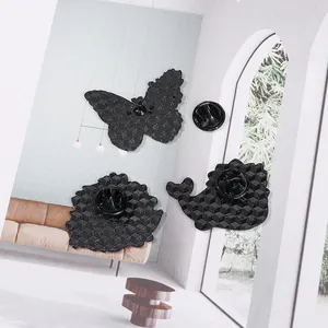 Three-piece set of matte black enamel butterfly and whale pins with rubber clasps