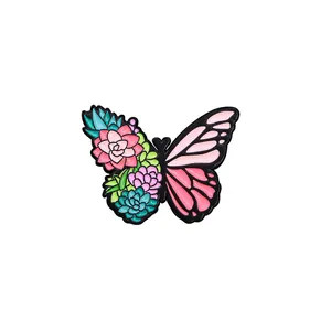 Colorful butterfly brooch with succulent plants design on black metal frame and pink wings
