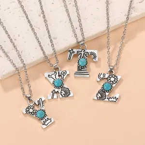 Detailed close-up of retro bohemian turquoise initial necklaces with engraved western motifs