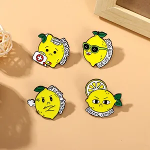 Set of four cute cartoon lemon enamel pins with unique expressions in yellow alloy metal