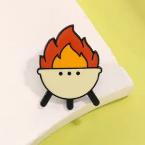 Detail of creative BBQ grill enamel pin with colorful flames and metal stand